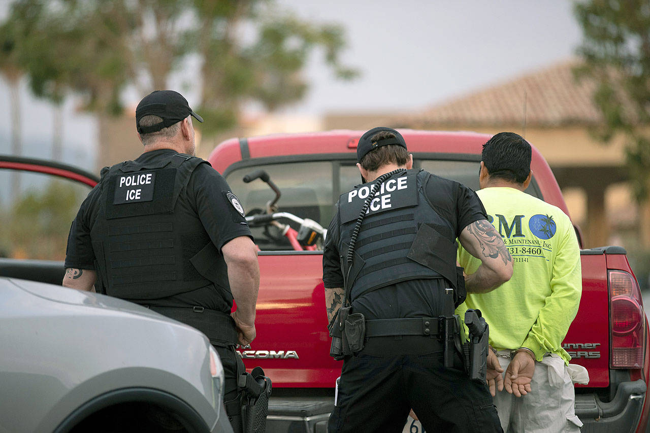 U.S. Immigration and Customs Enforcement officers detain a man during an operation in Escondido, California, on July 8. The administration of President Donald Trump announced Monday that it will vastly expand the authority of immigration officers to deport migrants without allowing them to first appear before judges, its second major policy shift on immigration in eight days. Starting Tuesday, fast-track deportations can apply to anyone in the country illegally for less than two years. (AP Photo/Gregory Bull, File)