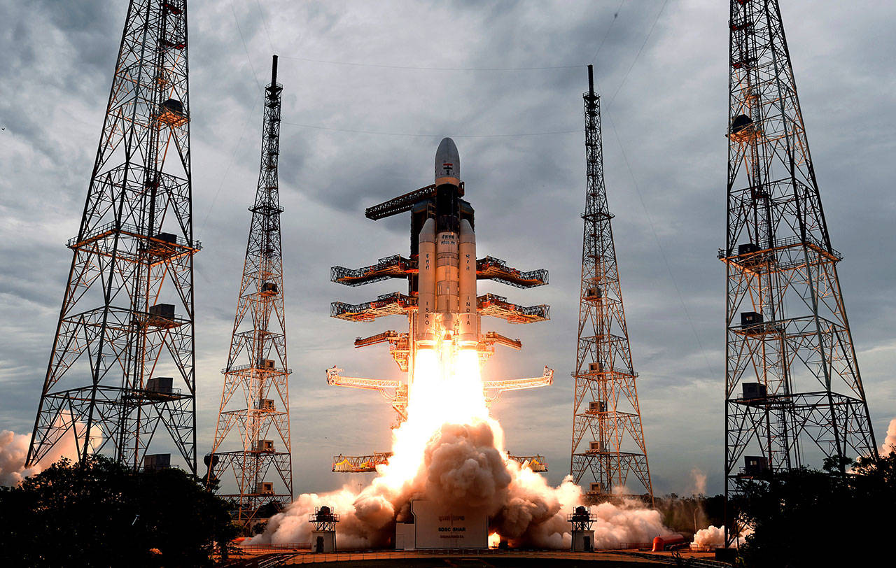 This photo released by the Indian Space Research Organization (ISRO) shows its Geosynchronous Satellite launch Vehicle (GSLV) MkIII carrying Chandrayaan-2 lift off from Satish Dhawan Space center in Sriharikota, India, on Monday. India successfully launched an unmanned spacecraft to the far side of the moon on Monday, a week after aborting the mission due to a technical problem. (Indian Space Research Organization via AP)