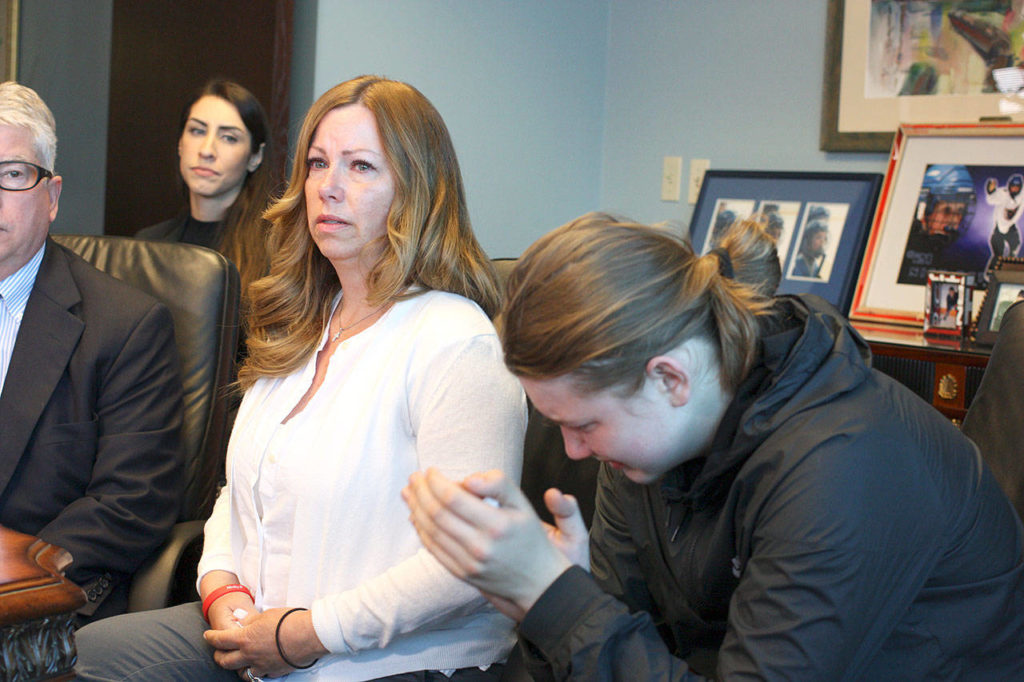 Jayni Peters, shown here with her son, Jack Peters, on June 6 at the Campiche Arnold law firm in Seattle, said her son, Nickolas Peters, didn’t deserve to be killed. ( Zachariah Bryan / Herald file)
