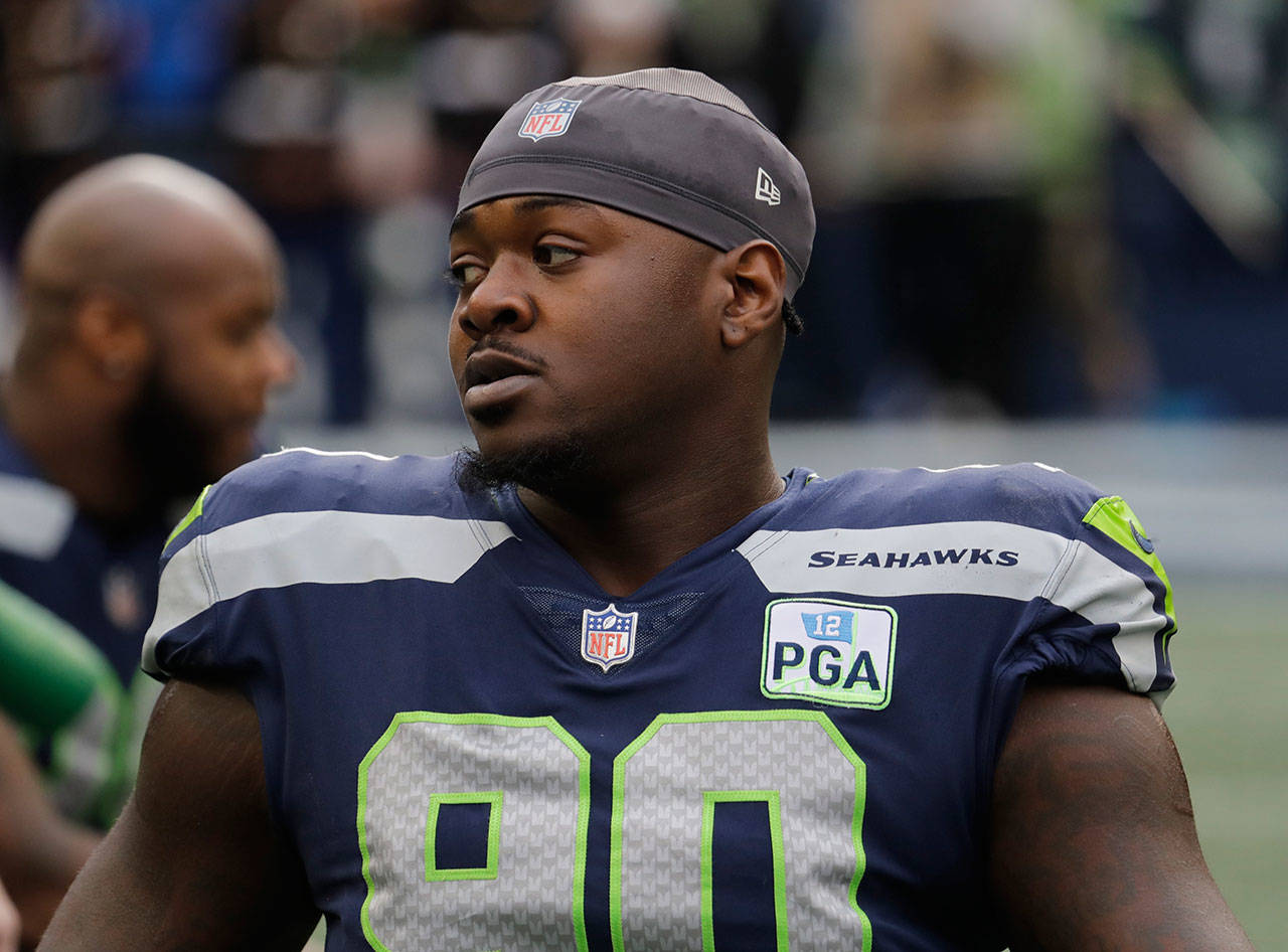 Seahawks defensive tackle Jarran Reed stretches before a game against the 49ers on Dec. 2, 2018, in Seattle. (AP Photo/Elaine Thompson)