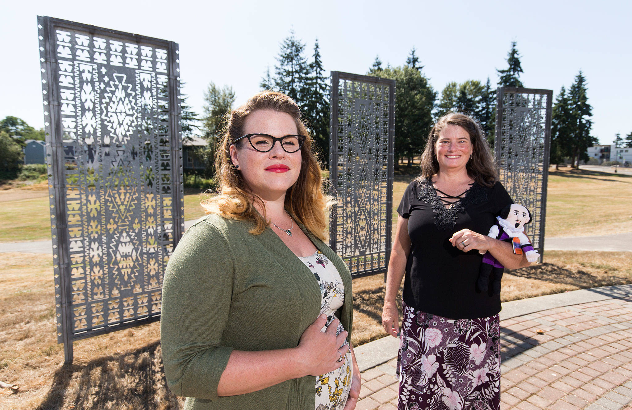 Everett’s Delta Neighborhood Association’s Mary Fosse, left, and Pamela Hanes are helping to bring Seattle Shakespeare Co.’s summer touring troupe, known as Wooden O Productions, to Wiggums Hollow Park. The free play is this Saturday. (Andy Bronson / The Herald)