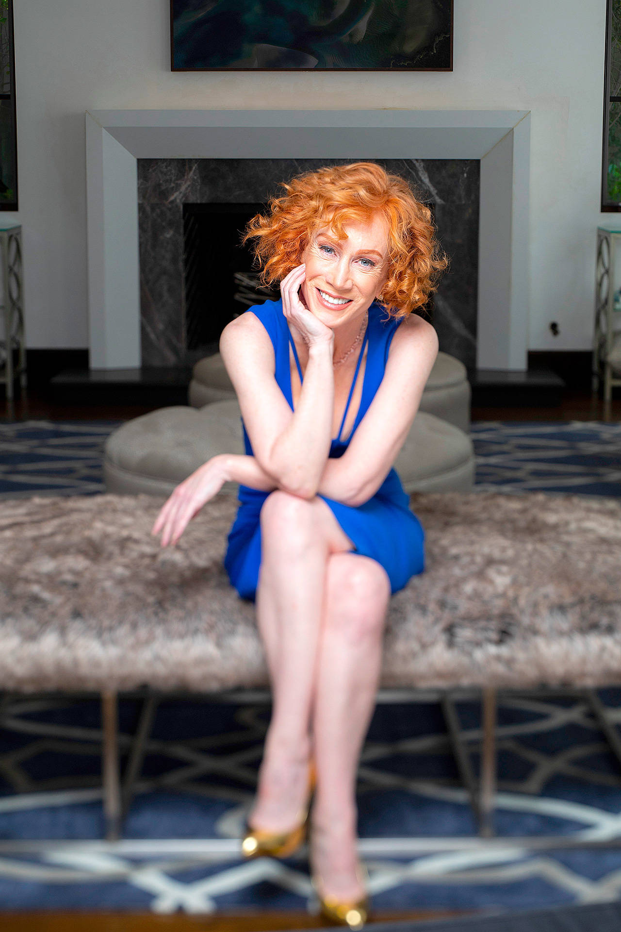 Comedian and actress Kathy Griffin, shown here in her Los Angeles home, has made a documentary comedy film in which she discusses the fallout from a controversial 2017 photograph where she posed with a fake severed head meant to look like Donald Trump. (Los Angeles Times)