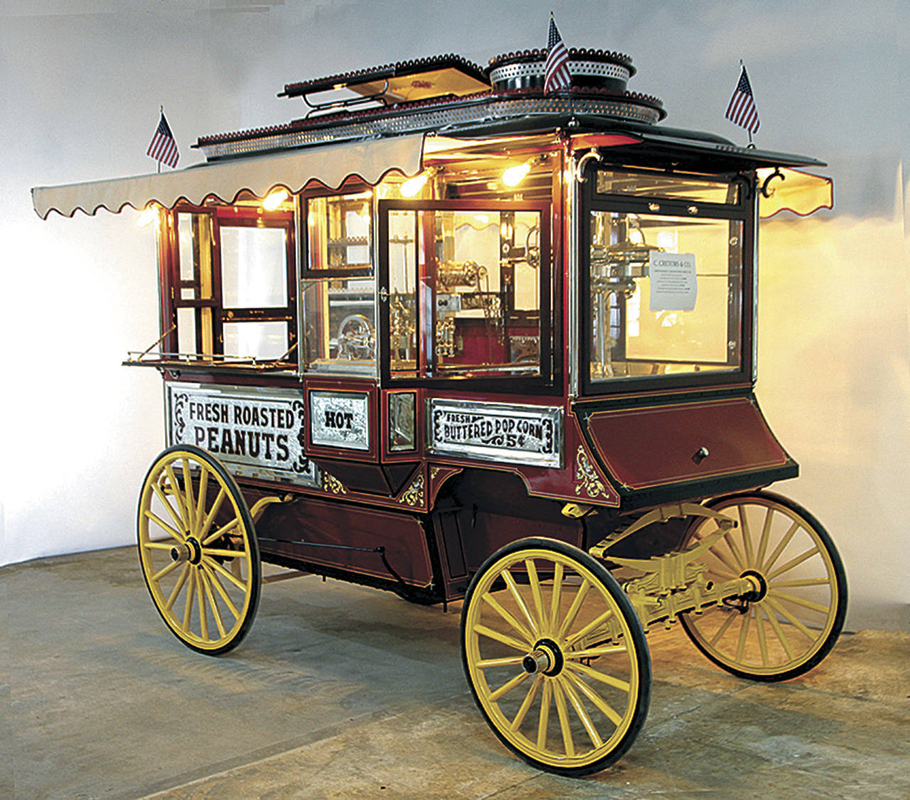 This modernized popcorn wagon, which looks on the outside like it did in 1910, sold at an antiques auction for $34,000. (Cowles Syndicate Inc.)