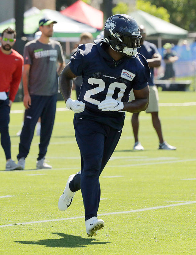 Seahawks running back Rashaad Penny runs a drill during training camp on July 25, 2019, in Renton. (AP Photo/Ted S. Warren)