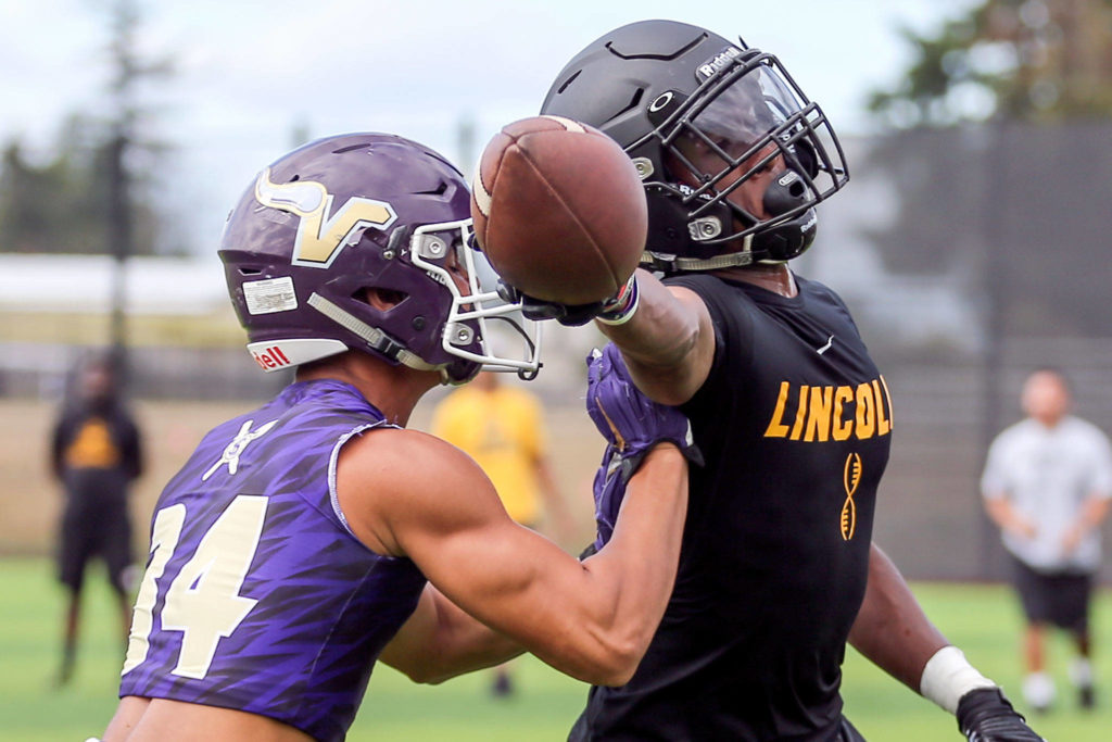 Lake Stevens play Lincoln in the quarterfinals Saturday afternoon during the Cougar Championship Passing Tournament at Lakewood High School in Marysville on July 27, 2019. (Kevin Clark / The Herald)
