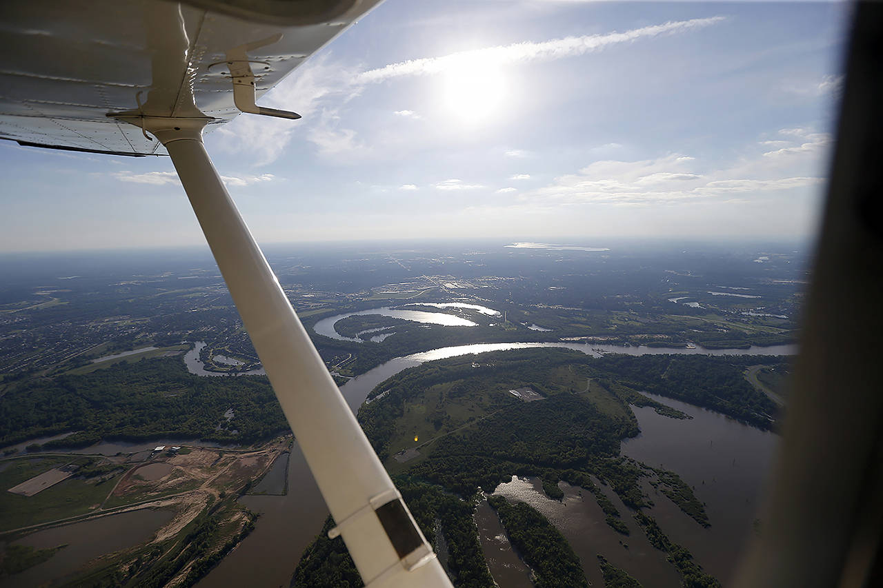 In this 2017 photo, the Red River is seen in this aerial photo from a private plane near Shreveport, Louisiana. The Department of Homeland Security plans to issue a security alert Tuesday for small planes, warning that modern flight systems are vulnerable to hacking if someone manages to gain physical access to the aircraft. (AP Photo/Gerald Herbert, file)