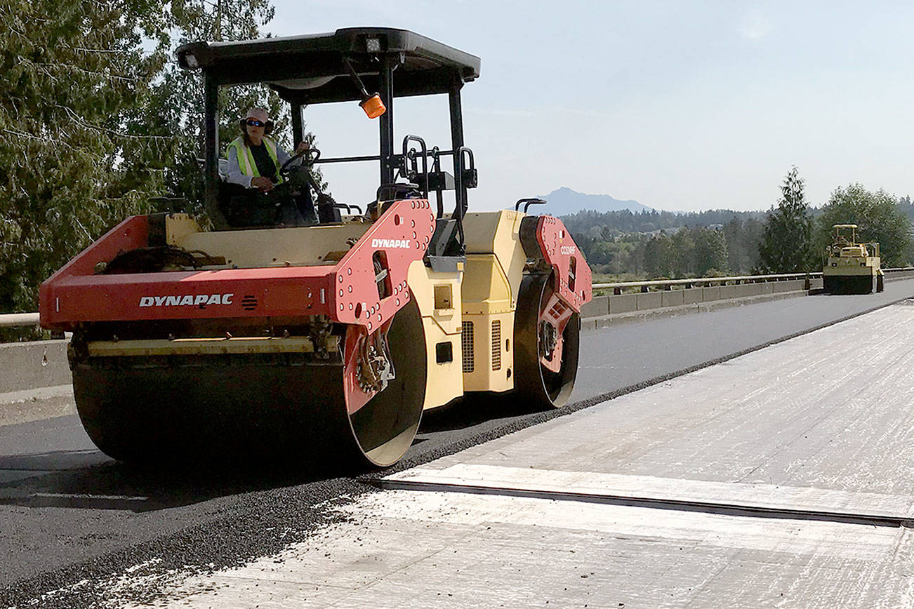 Paving work on the U.S. 2 trestle during a weekend last year when the weather actually cooperated with moisture-sensitive construction. (Washington State Department of Transportation)