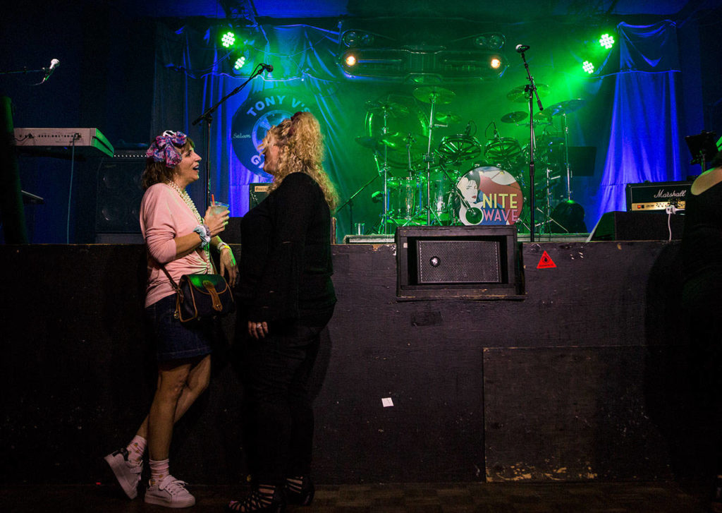 Some ’80s music fans talk before the start of a Nite Wave show at Tony V’s Garage in Everett. (Olivia Vanni / The Herald)
