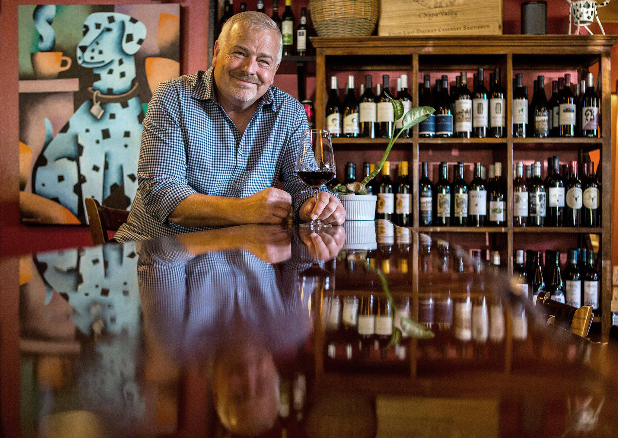 Jeff Wicklund, wine consultant and bar partner, at Cafe Zippy’s new wine bar C.Vines on June 24 in Everett. (Olivia Vanni / The Herald)