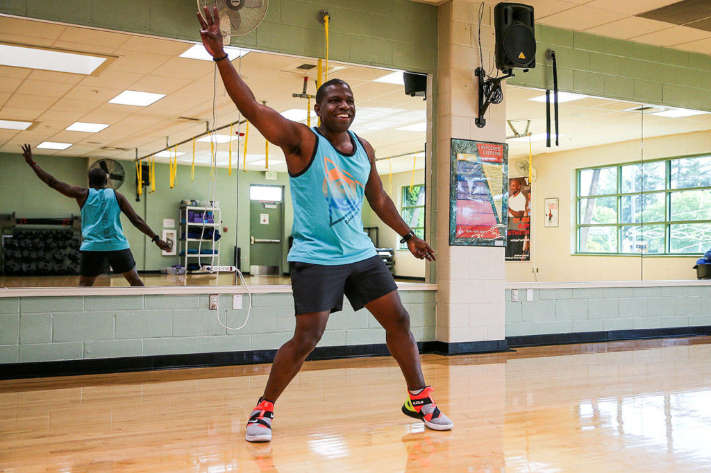 Mike Dixon prepares new steps for a Zumba class at the Mukilteo YMCA. He recently was certified as an instructor and has been training to have his own class. (Kevin Clark / The Herald)
