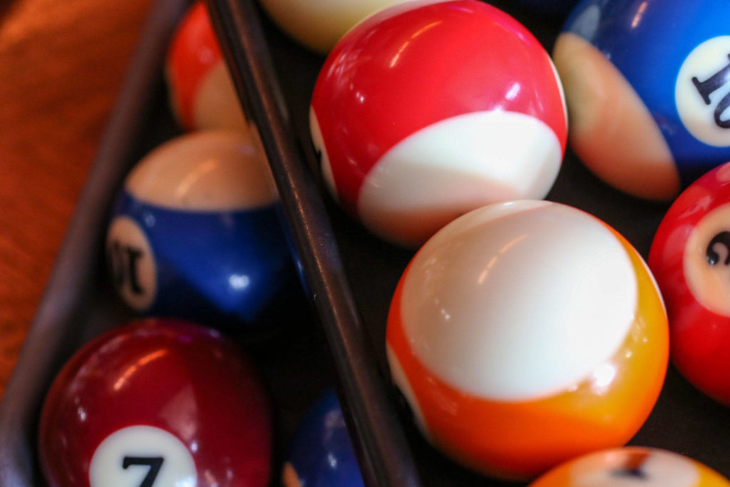 Trays of balls await customers at Golden Fleece Billiards in Everett. (Kevin Clark / The Herald)
