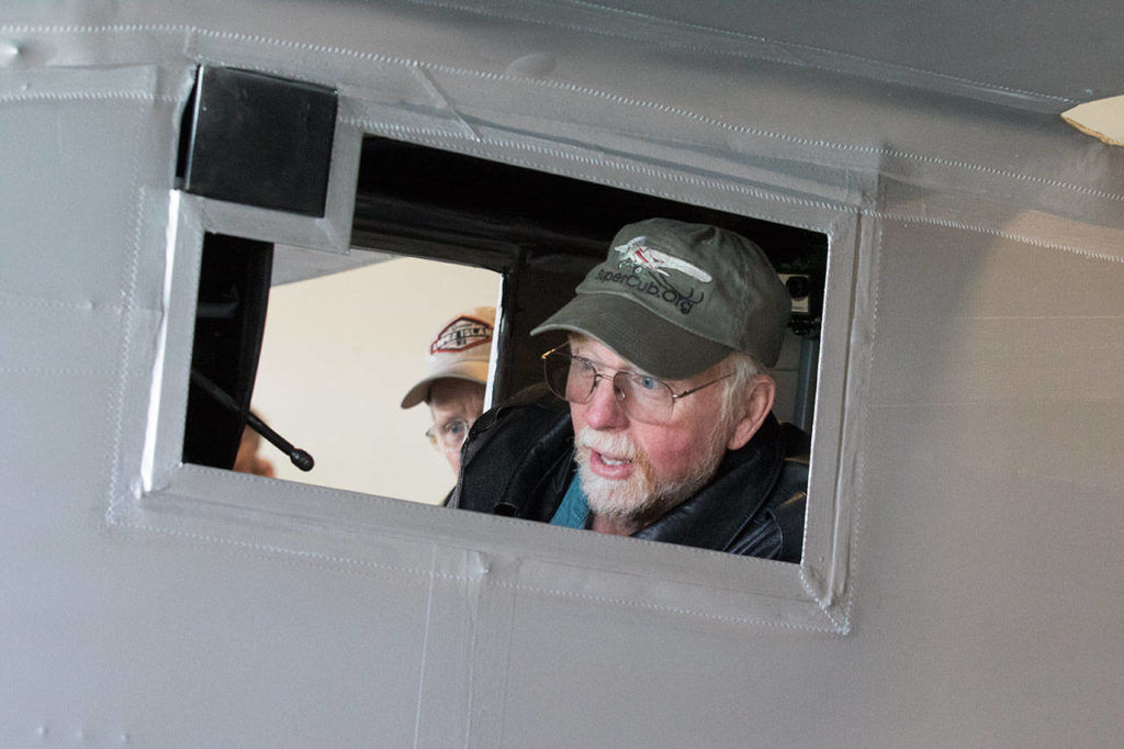 Pilot Ron Fowler looks out the small window of the Spirit of St. Louis replica plane before taking it on its first flight from Arlington Municipal Airport on July 28. (Andy Bronson / The Herald)
