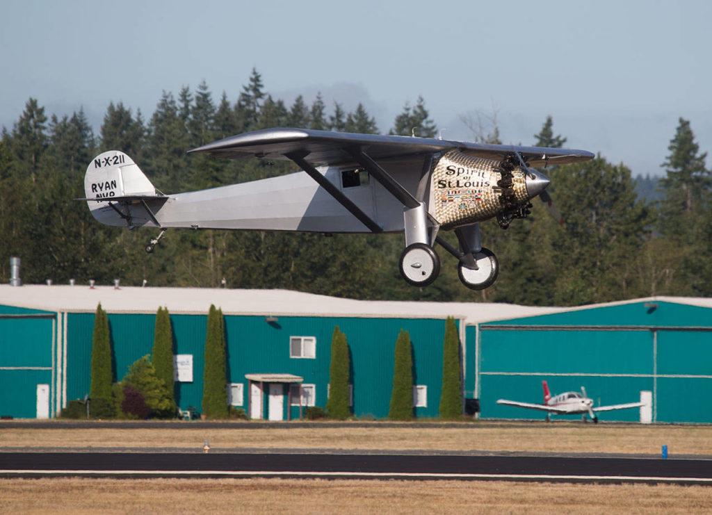 Ron Fowler pilots John Norman’s replica of the Spirit of St. Louis in for a touch-and-go landing at Arlington Municipal Airport on July 28. (Andy Bronson / The Herald)
