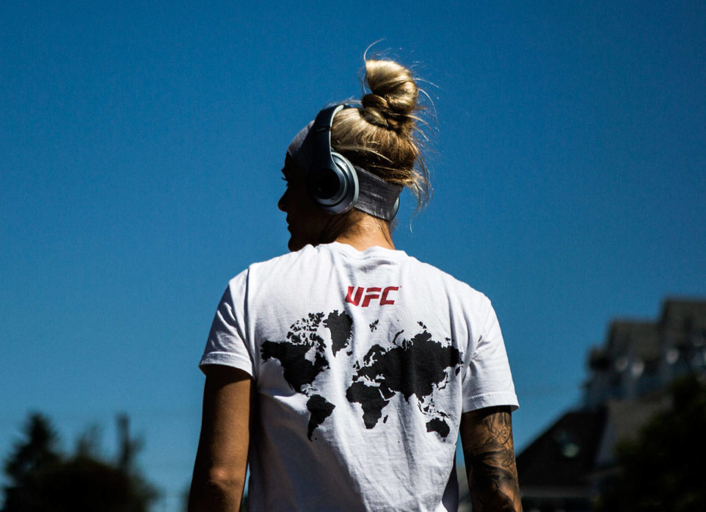 Miranda Granger pauses in a UFC shirt during her run on July 26, 2019, in Everett. (Olivia Vanni / The Herald)
