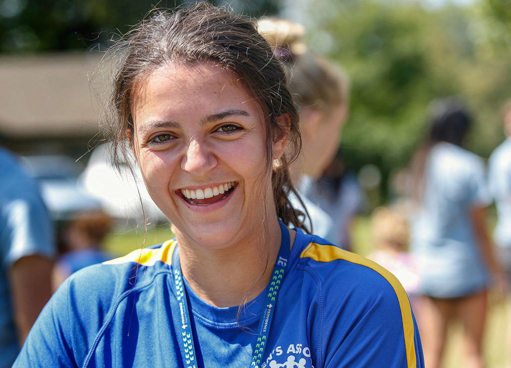 Megan Pfohl, 20, a student at Boise State University works as unit leader at Camp Prov, a program for children with special needs at Everett’s Forest Park. (Dan Bates / The Herald)
