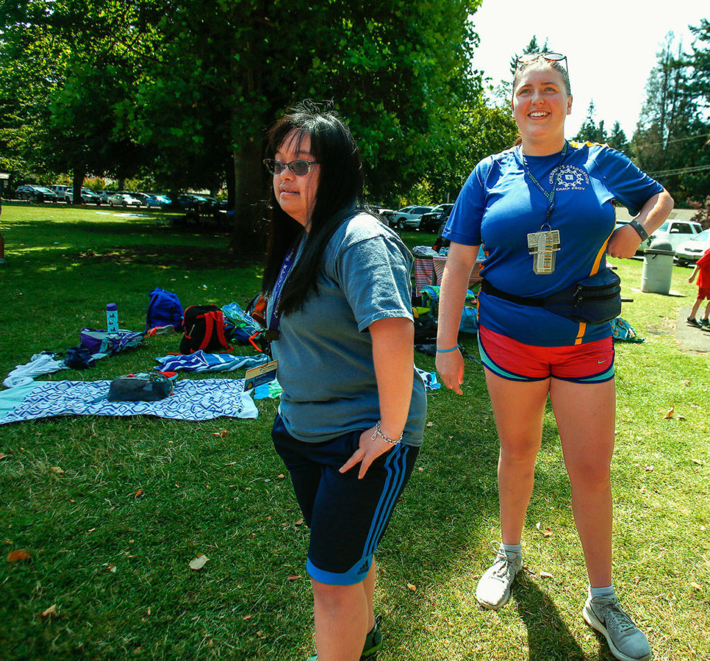 Bre Baylon (left) spends time hanging out with Camp Prov unit leader Siena Utt, 20, a student at the University of Washington who lives in Everett. (Dan Bates / The Herald)
