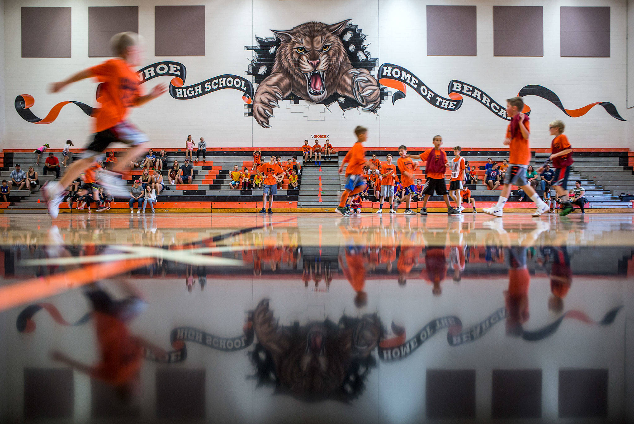 Kids participate in a youth basketball camp Wednesday at Monroe High School, whose athletic teams were named the Bearcats in 1924 to honor famous Monroe boxer Dode “Bearcat” Bercot. (Olivia Vanni / The Herald)