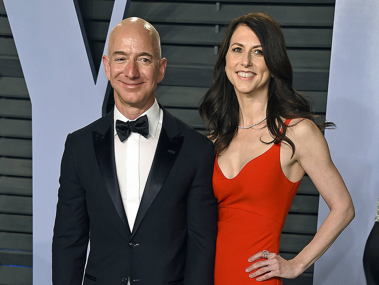 In this 2018 photo, Jeff Bezos and his wife, MacKenzie Bezos, arrive at the Vanity Fair Oscar Party in Beverly Hills, California. (Photo by Evan Agostini/Invision/AP, File)