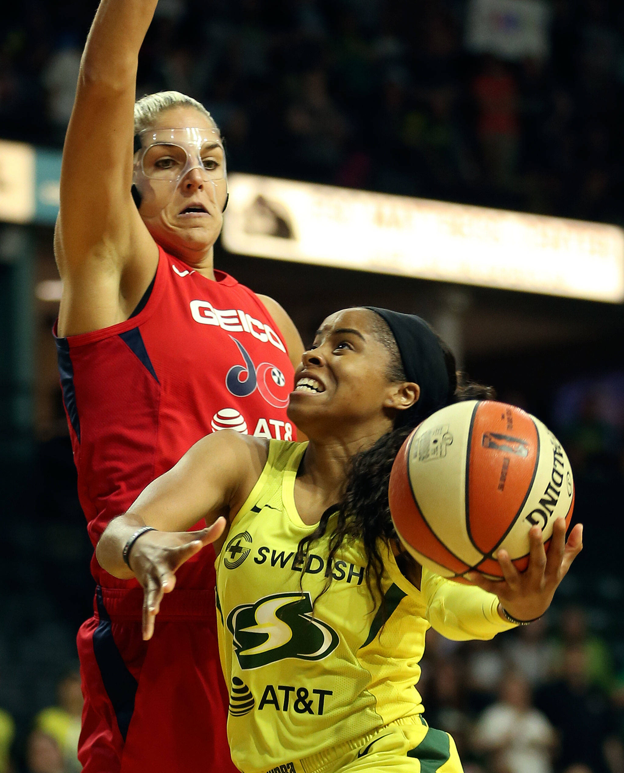 Seattle’s Jordin Canada attempts a shot with Washington’s Elena Delle Donne defending during a game on Aug. 2, 2019, at Angel of the Winds Arena in Everett. (Kevin Clark / The Herald)
