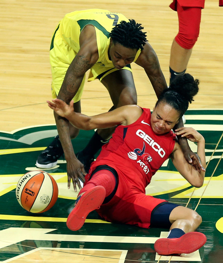 Seattle’s Natasha Howard steals the ball from Washington’s Kristi Toliver during a game on Aug. 2, 2019, at Angel of the Winds Arena in Everett. (Kevin Clark / The Herald)
