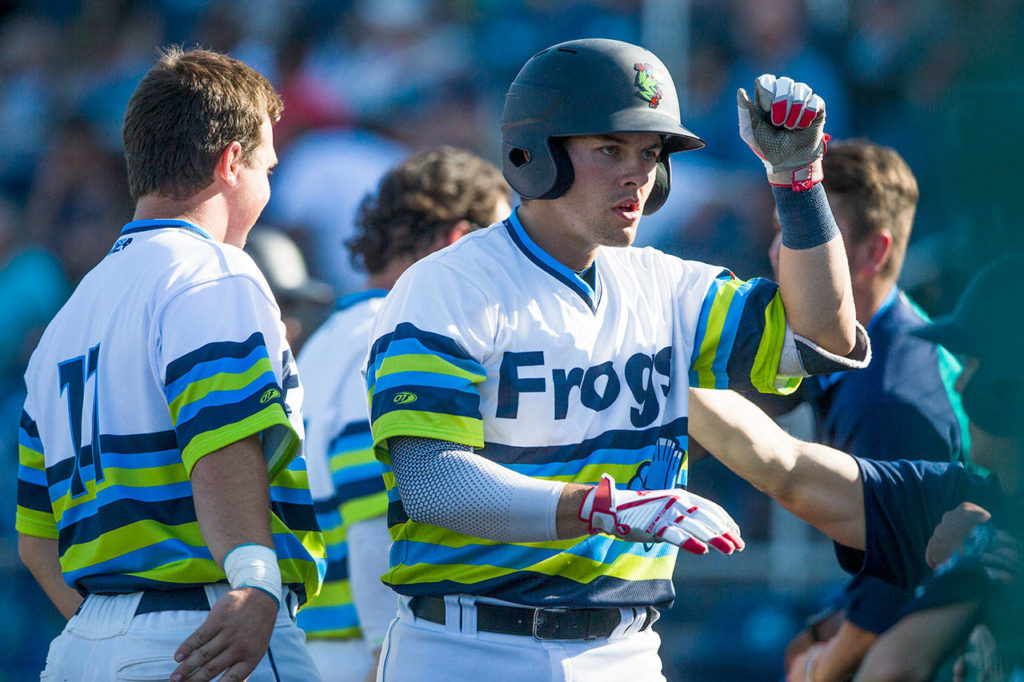 Everett’s Brennon Kaleiwahea celebrates with teammates after hitting a home run during the fifth inning of the AquaSox 7-6, 10-inning victory over Spokane on Sunday at Funko Field in Everett. (Olivia Vanni / The Herald)
