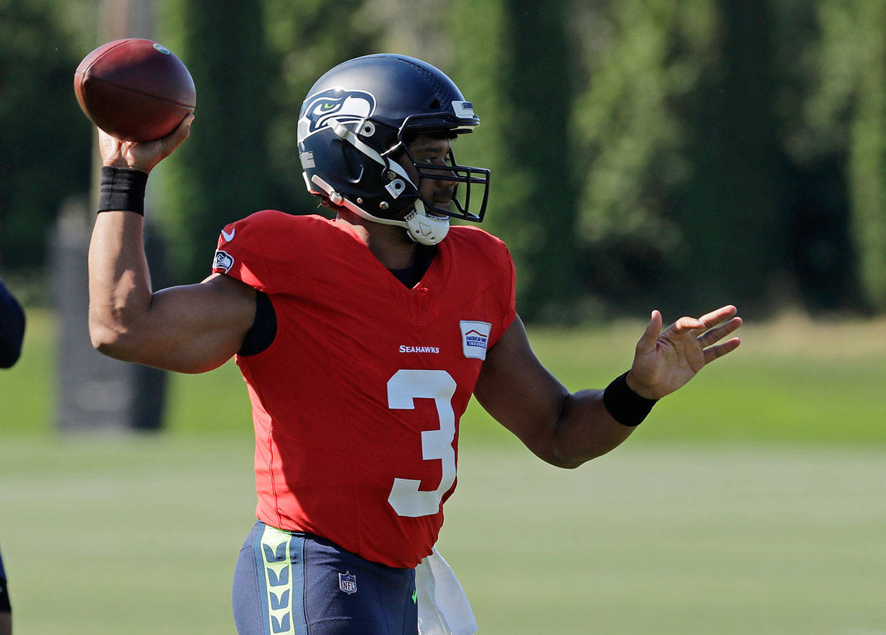 Seahawks quarterback Russell Wilson passes during training camp on July 29, 2019, in Renton. (AP Photo/Ted S. Warren)
