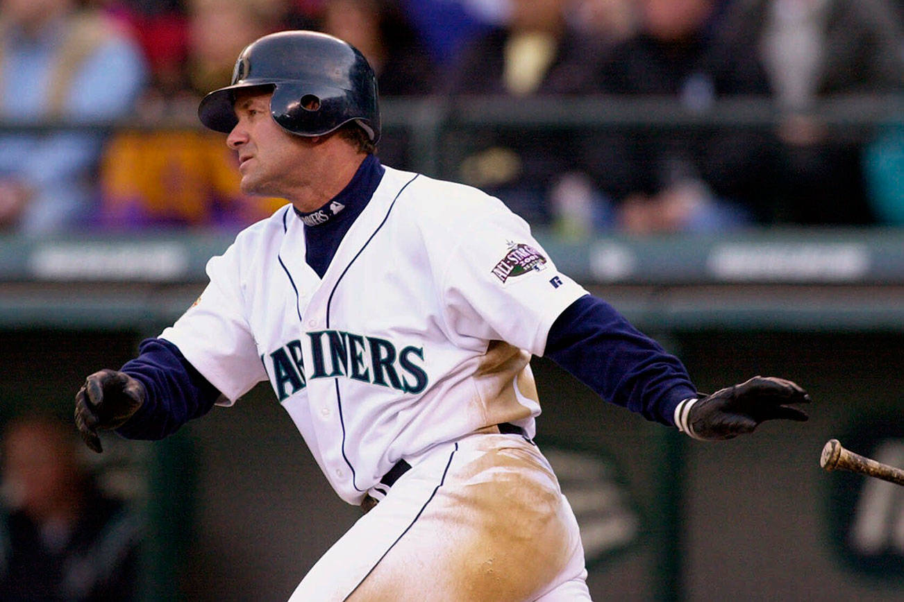 In this April 4, 2001, file photo, the Seattle Mariners’ Edgar Martinez drops his bat as he heads toward first on his sixth-inning, two-run double against the Oakland Athletics in Seattle. (AP Photo/Elaine Thompson, File)