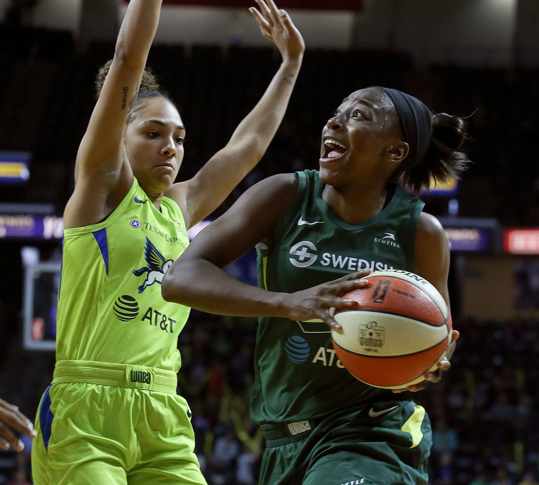 Seattle’s Jewell Loyd drives with Dallas’ Brooke McCarty-Williams during a game on Aug. 8, 2019, at Angel of the Winds Arena in Everett. (Kevin Clark / The Herald)