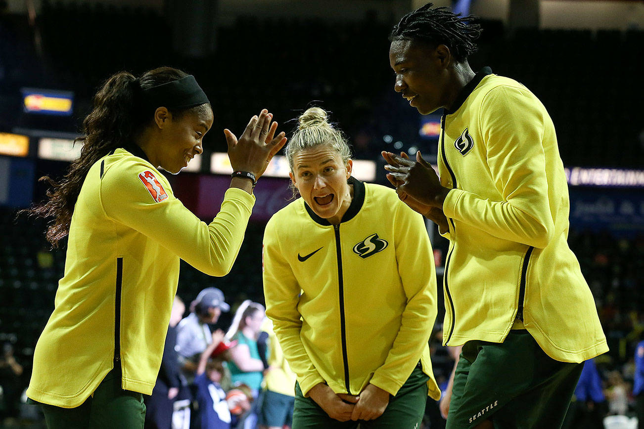 Seattle’s Jordin Canada (left to right) Sami Whitcomb and Natasha Howard run through pre-game rituals Thursday evening at Angel of the Wings in Everett on August 8, 2019. (Kevin Clark / The Herald)