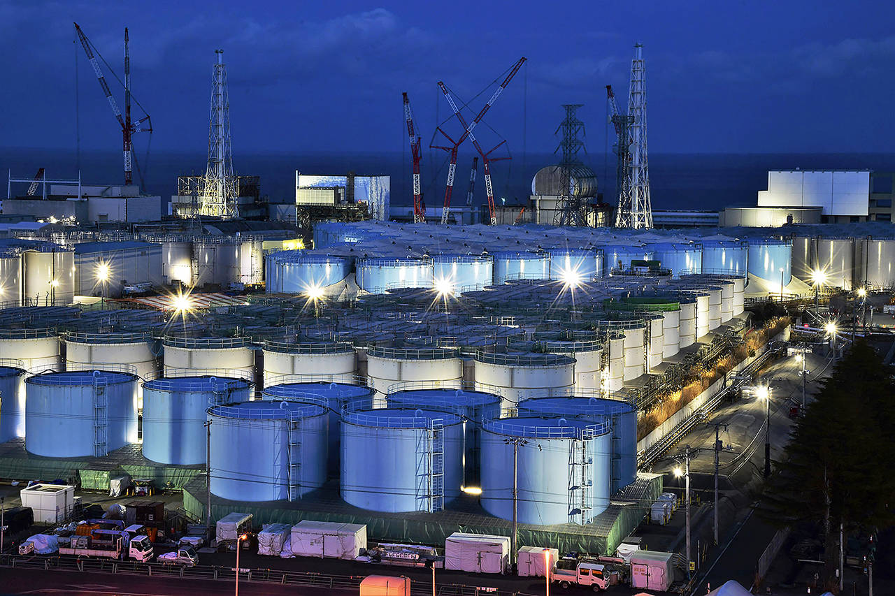 This Jan. 25 photo shows water tanks containing contaminated water that has been treated at the Fukushima Dai-ichi nuclear plant in Okuma town, Fukushima prefecture, northeastern Japan. (Kyodo News via AP file)