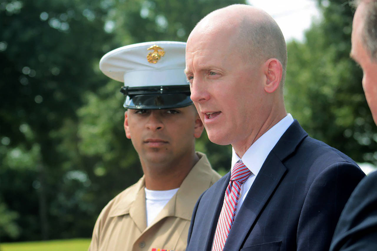 FBI Knoxville Special Agent in Charge Troy Sowers and U.S. Marine Cpl. Stewart Rembert were reunited during Sowers’ Aug. 9 retirement ceremony, 22 years after Sowers rescued a newborn Rembert following his 1997 kidnapping in Tacoma. (USMC)