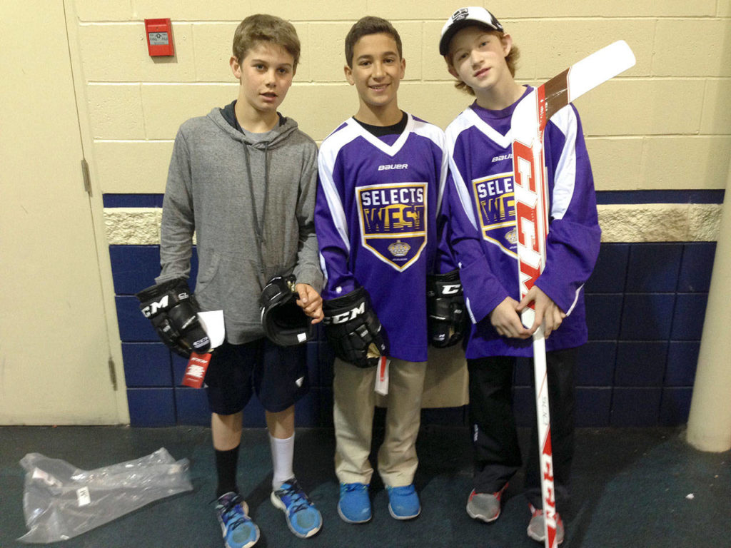 Dustin Wolf (right) poses with NHL No. 1 overall 2019 draft pick Jack Hughes (left) and and incoming Quinnipiac freshman Nick Kent (center) after being named All-Stars during a 2014 tournament in Vancouver. (Photo courtesy of the Wolf family)
