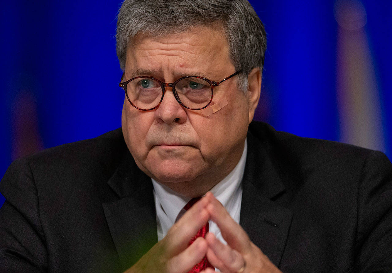 United States Attorney General William Barr listens to LaToya Cantrell, New Orleans mayor, during the Grand Lodge Fraternal Order of Police’s 64th National Biennial Conference at the Ernest N. Morial Convention Center in New Orleans on Monday. Barr said Monday that there were “serious irregularities” at the federal jail where Jeffrey Epstein took his own life this weekend as he awaited trial on charges he sexually abused underage girls. (David Grunfeld/The Advocate via AP)