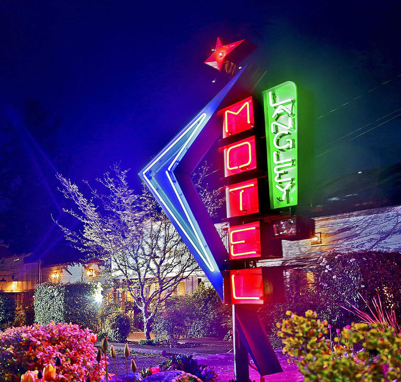 The 9-foot Langley Motel neon sign by Tim Leonard is the city’s unofficial welcome sign. The motel owners wanted a retro Vegas-style sign. (Michael Stadler / Stadler Studio Photography)
