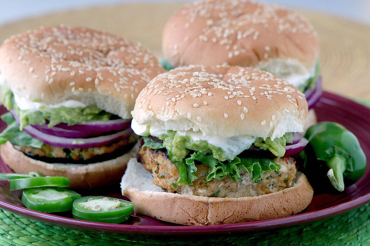 Slather these cheddar jalapeno chicken burgers with guacamole. (Hillary Levin/St. Louis Post-Dispatch)