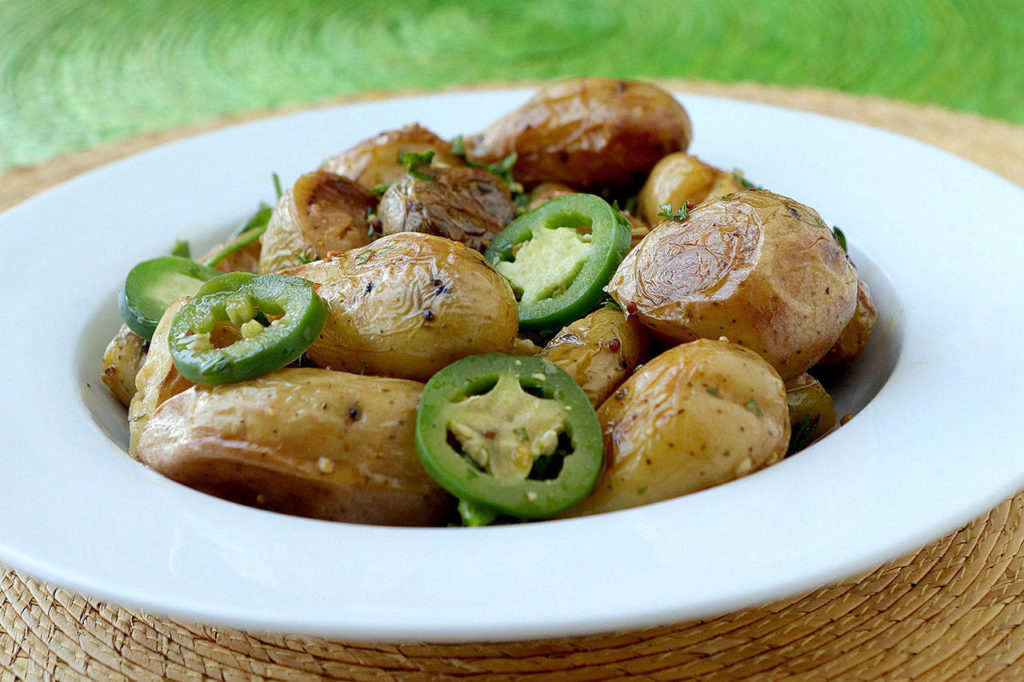 Smashed fingerlings make a lovely sidedish with or without the sliced jalapenos. (Hillary Levin/St. Louis Post-Dispatch)
