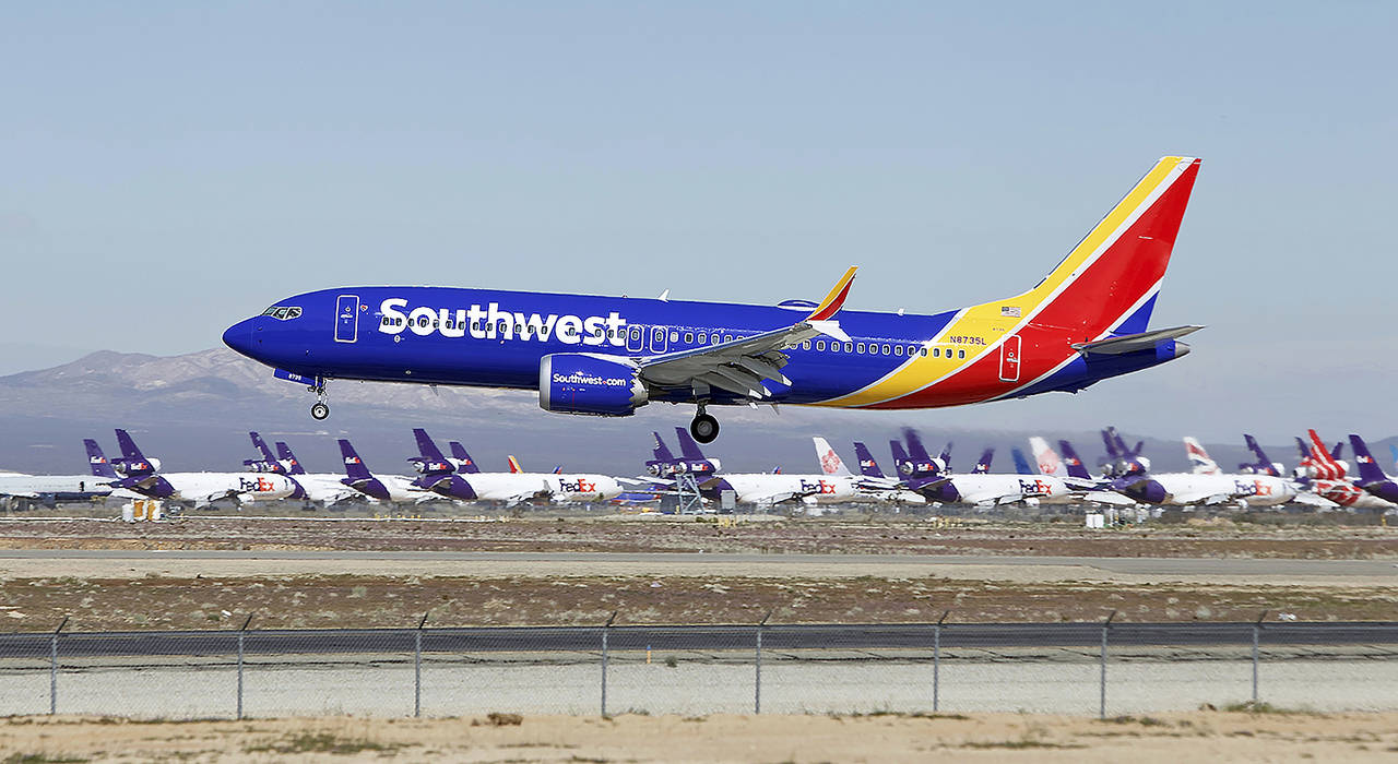 In this March 23 photo, a Southwest Airlines Boeing 737 Max aircraft lands at the Southern California Logistics Airport in the high desert town of Victorville, California. (AP Photo/Matt Hartman, File)