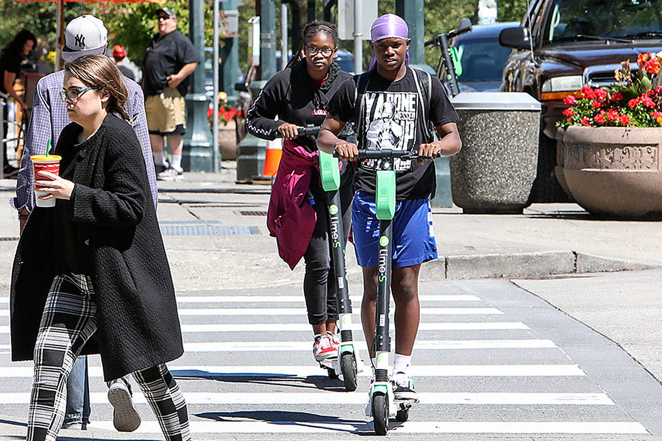 In May, 100 rentable e-scooters were dropped in Everett and since have been whizzing down sidewalks in the city. (Lizz Giordano / The Herald)