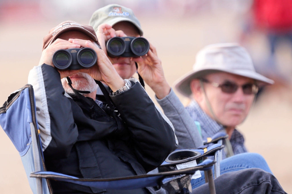 Spectators at the Arlington Fly-in at Arlington Municipal Airport on Friday evening. (Kevin Clark / The Herald)
