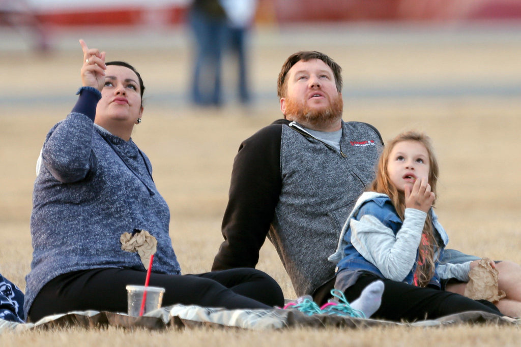 Families enjoy the show at the Arlington Fly-in at Arlington Municipal Airport on Friday evening. (Kevin Clark / The Herald)
