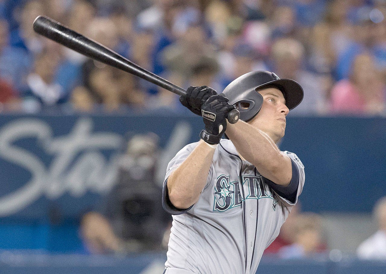 Seattle’s Kyle Seager follows through on his eighth-inning home run Saturday in Toronto, which was the difference in the Mariners’ 4-3 win over the Blue Jays. (Fred Thornhill/The Canadian Press via AP)
