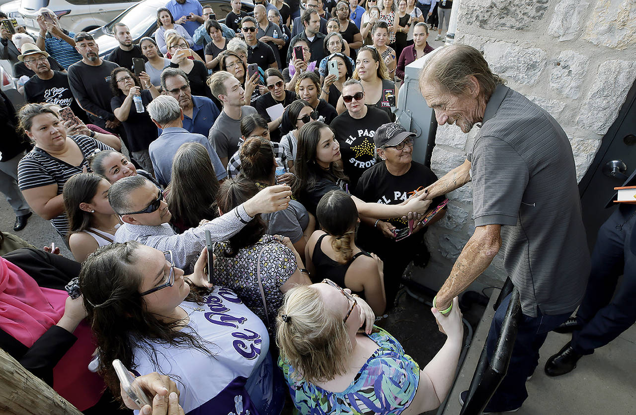 Antonio Basco greets some of the hundreds in line to attend his longtime companion Margie Reckard’s funeral at La Paz Faith Memorial & Spiritual Center in El Paso, Texas, on Friday. Without much family and friends in town, Basco invited the public to the service. Reckard was among those killed in a mass shooting on Aug. 3. (Mark Lambie/The El Paso Times via AP)