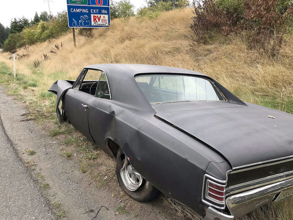 A 1967 Chevelle came loose from a flatbed trailer and crashed into another vehicle Sunday morning on I-5 in Everett. (Washington State Patrol)
