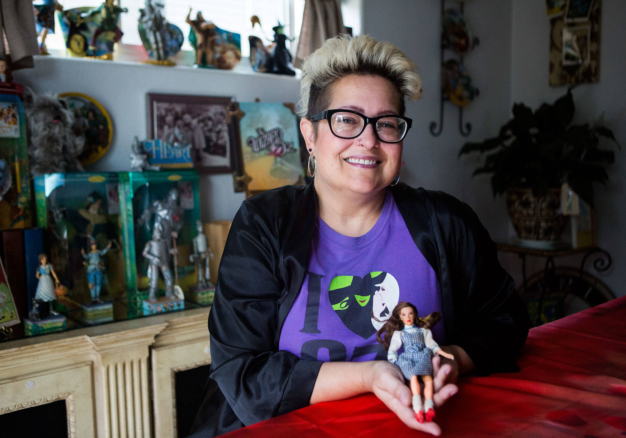 Stacey Morris, a Wizard of Oz collector, at her home with the Dorothy doll that started her love of all things Wizard of Oz on Friday, Aug. 16, 2019 in Granite Falls, Wash. (Olivia Vanni / The Herald)