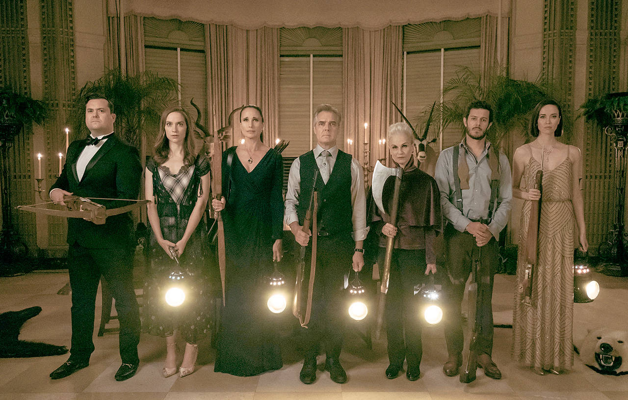 From left, Kristian Bruun, Melanie Scrofano, Andie MacDowell, Henry Czerny, Nicky Guadagni, Adam Brody and Elyse Levesque play a homicidal upper-crust family in “Ready or Not.” (Fox Searchlight Pictures)