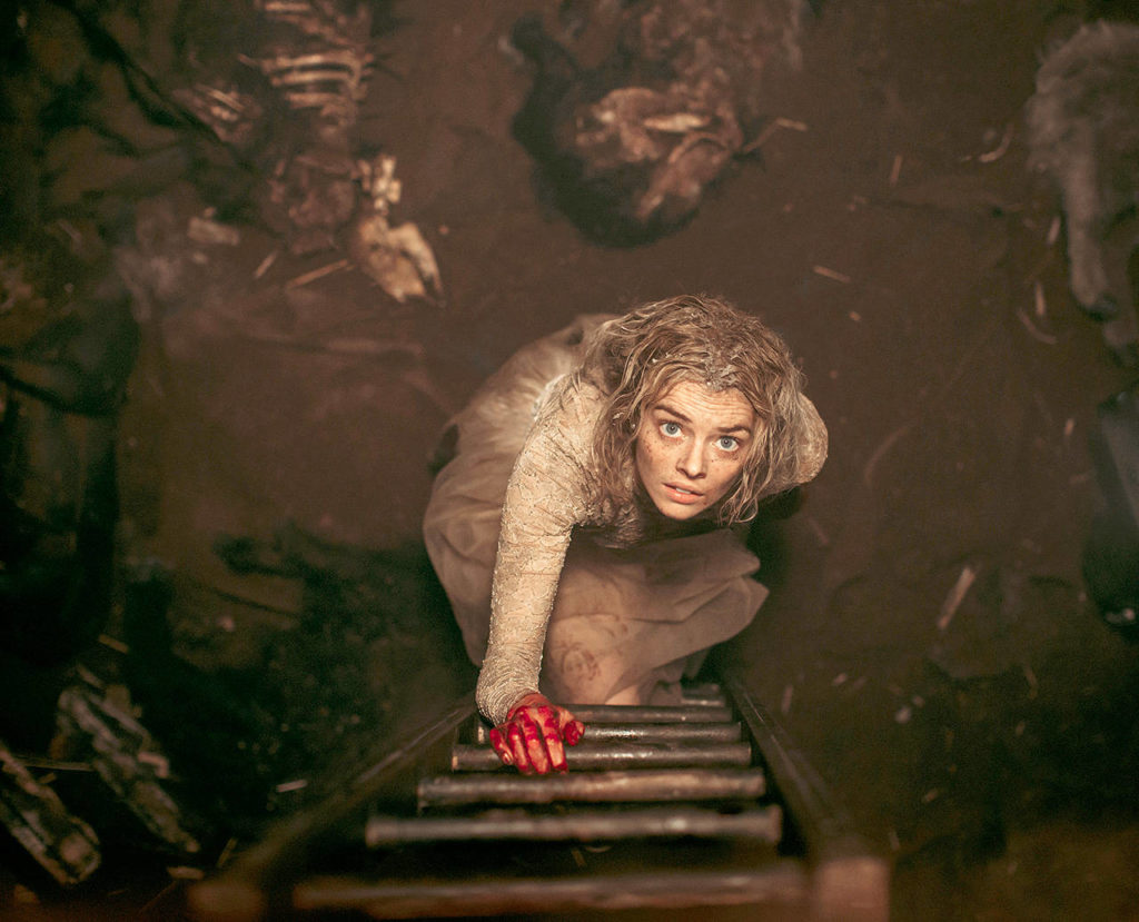 Samara Weaving plays a bride who tries to stay alive until dawn on her wedding day as her in-laws hunt her down and try to kill her in “Ready or Not.” (Fox Searchlight Pictures)
