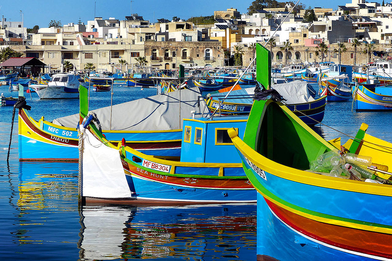 According to tradition, the colors of these Maltese fishing boats represent a fisherman’s home village. (Gretchen Strauch / Rick Steves’ Europe)