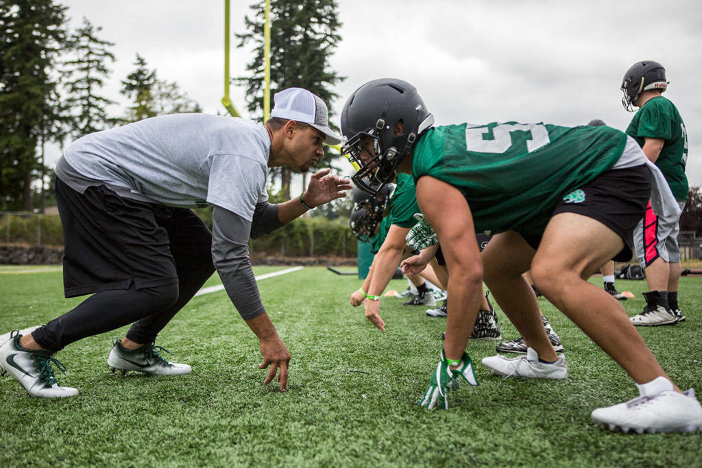 Jackson assistant coach J.R. Wells gets in a defensive stance against Exavier Bonifacio. (Olivia Vanni / The Herald)
