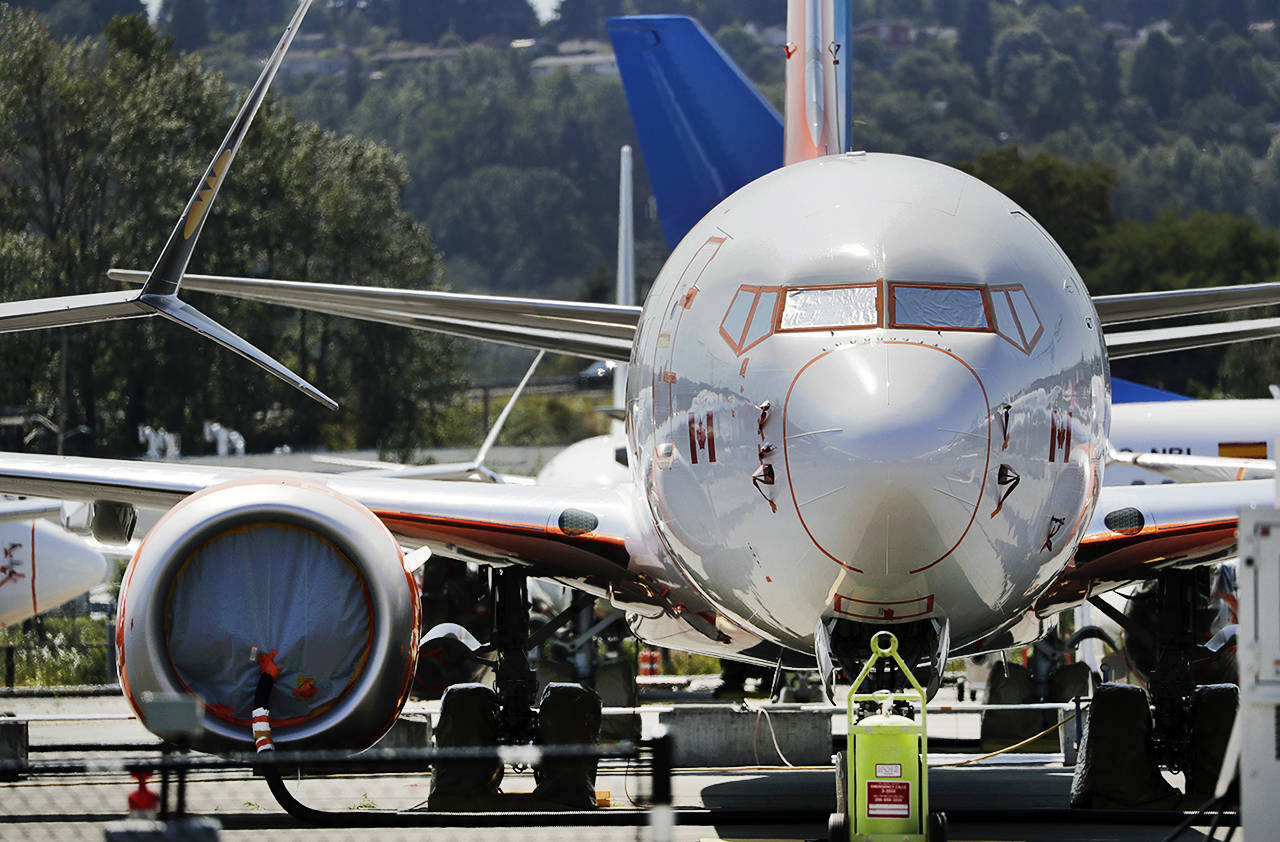 A grounded Boeing 737 MAX airplane sits with dozens of others crowding a parking area adjacent to Boeing Field on Aug. 15. in Seattle. (AP Photo/Elaine Thompson)