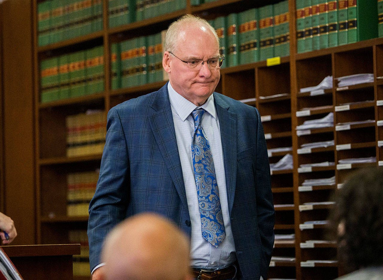 Simeon Berkley, 74, walks out of the Snohomish County Courthouse in Everett after his arraignment on Aug. 14. (Olivia Vanni / Herald file)